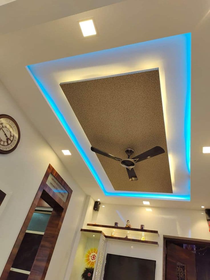Gypsum false ceiling with textured centre panel and blue-warm LED cove lighting, Chandigarh living room